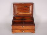 an old wooden box with a drawer inside of it on a white surface