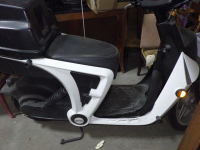a scooter that is parked in a garage