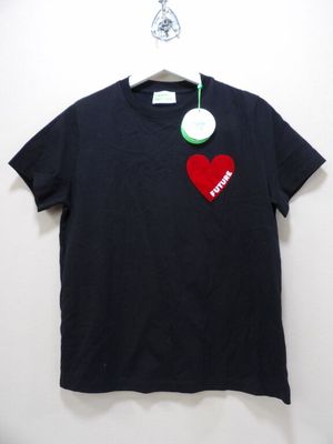 black t - shirt with a red heart on it hanging on a hanger