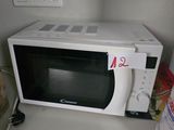 a microwave that is sitting on a counter in a kitchen