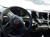 dashboard of a car with a steering wheel and dashboard controls