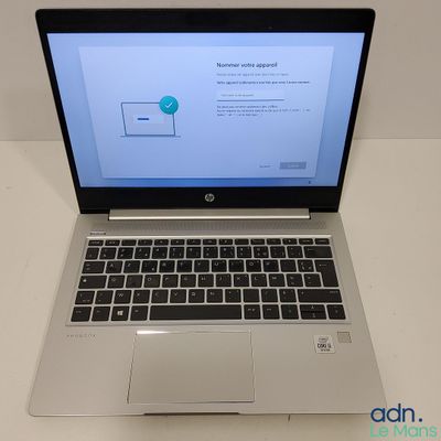 an open laptop computer sitting on top of a white table