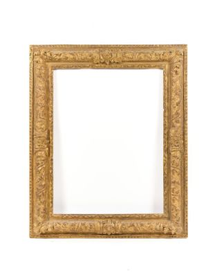 an antique gold frame with a white background
