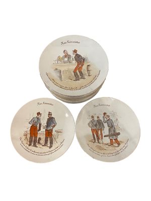 trois assiettes sur lesquelles figurent les portraits d'un homme et d'une femme