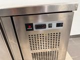 a stainless steel oven with the door open on the floor