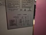 a picture of a white refrigerator with a sign on it
