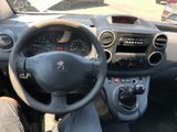 the interior of a car with a steering wheel and dashboard controls