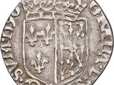 an old silver coin with a coat of arms on it