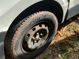 a close up of a car tire on the ground