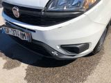 a white car that is parked in a parking lot