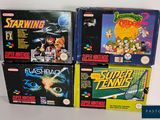 a lot of video games on display on a shelf