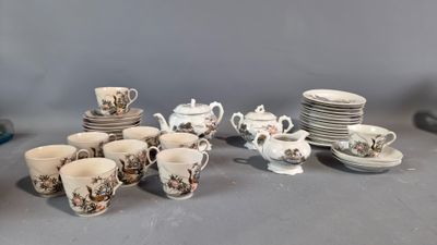 a lot of cups and saucers on the table