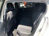the back seats of a car are empty in a parking lot