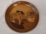 a picture of a plate with a picture of a bridge on it