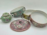 a tea pot, tea pot, and other items on a table