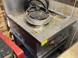 an image of a stove in a kitchen with a lot of wood