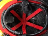 a close up of a fireman ' s helmet with a red cross mark on it