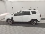 the white dacia is parked in the garage of a building