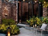 a small patio with a lot of lights on it