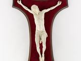 an image of a crucifix hanging on a wall with a red background