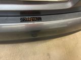 a close up of the bumper of a car with a sticker on it