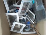 a cardboard box full of electronic devices on the floor
