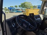 a view of the inside of a truck from the driver ' s seat