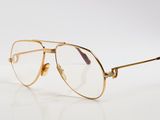 an image of a pair of glasses sitting on top of a white surface