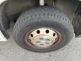 a close up of a flat tire on a vehicle