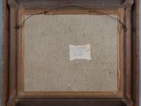 an old picture frame with a piece of paper on it