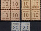 a close up of a group of stamps with numbers on them