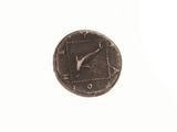 a coin with a clock on it on a white surface