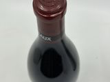 a bottle of wine that is sitting on a table