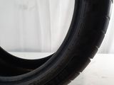 a close up of a tire on a white surface