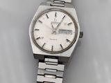 an image of a watch on a white surface with a white background