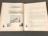 an open book with a picture of a building on it