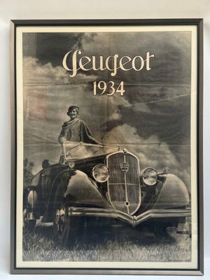an old black and white photo of a woman sitting on top of a car
