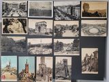 many pictures of buildings on the wall of this room