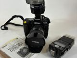 a camera and a flasher sitting next to each other