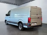 a silver van that is parked in a room