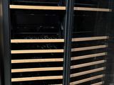 a wine cooler that has many bottles of wine inside of it