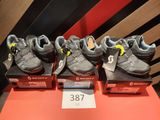 several pairs of shoes are on display in a shoe store