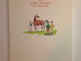 une photo d'un livre sur lequel figure l'image d'un cheval