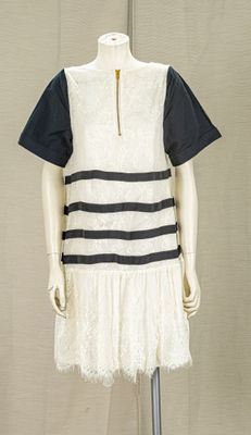 an image of a mannequin wearing a white and black dress
