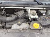 a picture of a car engine with its hood open