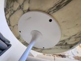 a white lamp that is on a table in a room