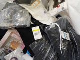 a pile of clothing that is sitting on a table