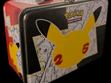 a tin lunch box with a picture of a pikachu on it