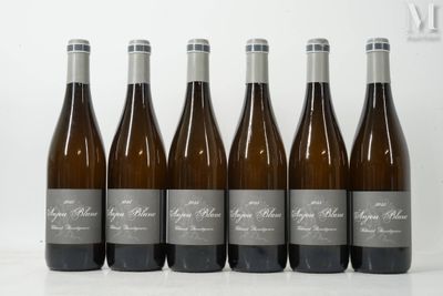 six bottles of wine are lined up in a row on a table