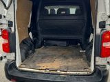 a white van with the back door open in a parking lot